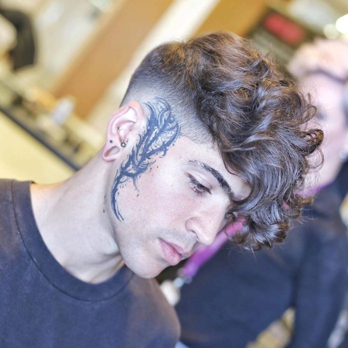 mikeyyyyyyy_ undercut fade with curly long hairstyle