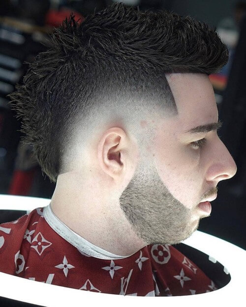 spiky mohawk fade hairstyle with bald skin side part hairstyle