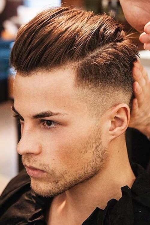 high slicked highlighted cold hair with taper fade design on f boy haircuts