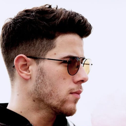 nick jonas side part haircut