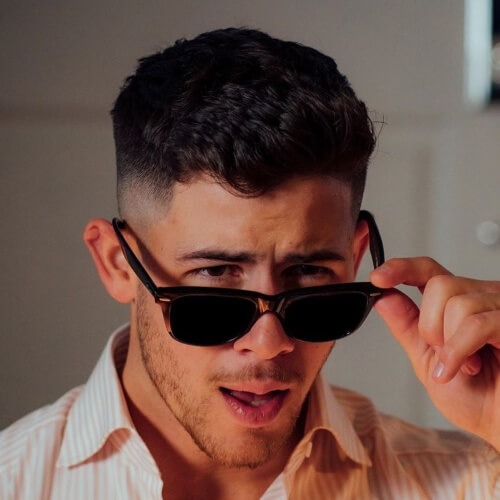 nick jonas side part skin fade