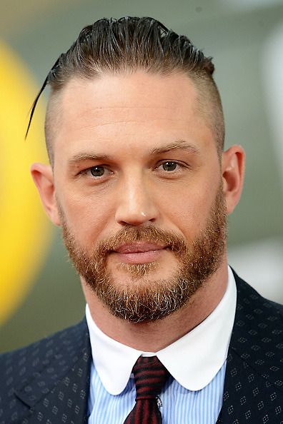 tom hardy medium length slicked back hair side part bald fade