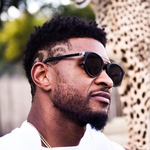 usher nieuw kapsel mohawk fade lange krullen